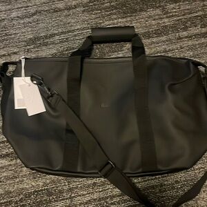 rains black weekend bag
